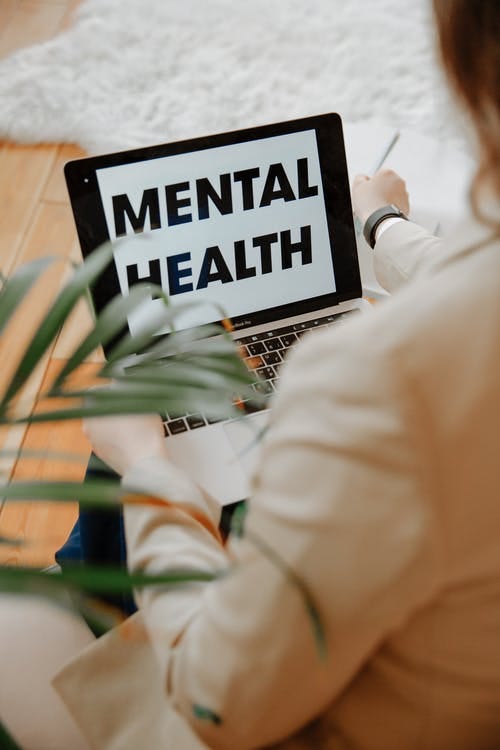 The Words Mental Health on Laptop Screen