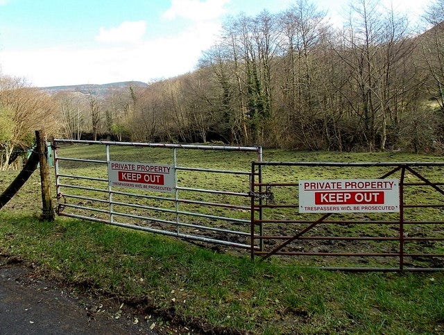 Keep out signs on field gates near Aberaman