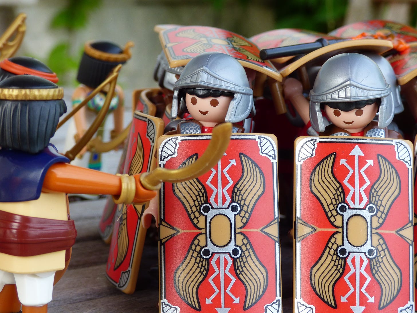 Close up of several Playmobil figures dressed in Roman costume.