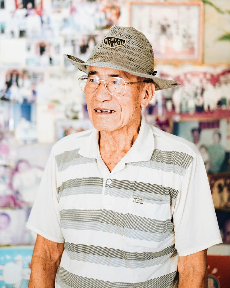 Lai Lin Sau 黎連壽, the main interlocutor of Ma Chi's documentary "Ballad on the Shore," dressed in a gray mesh hat and polo shirt