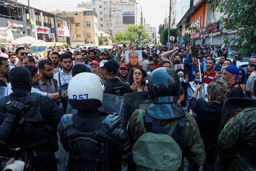 Palestinians protest the death of Palestinian human rights activist Nizar Banat who died after being arrested by Palestinian Authority security forces, in the West Bank city of Ramallah, on June 24, 2021. (Flash90)