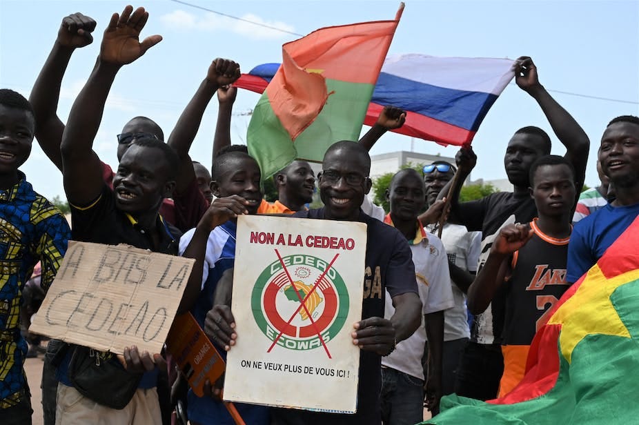 People holding flags and placards. 