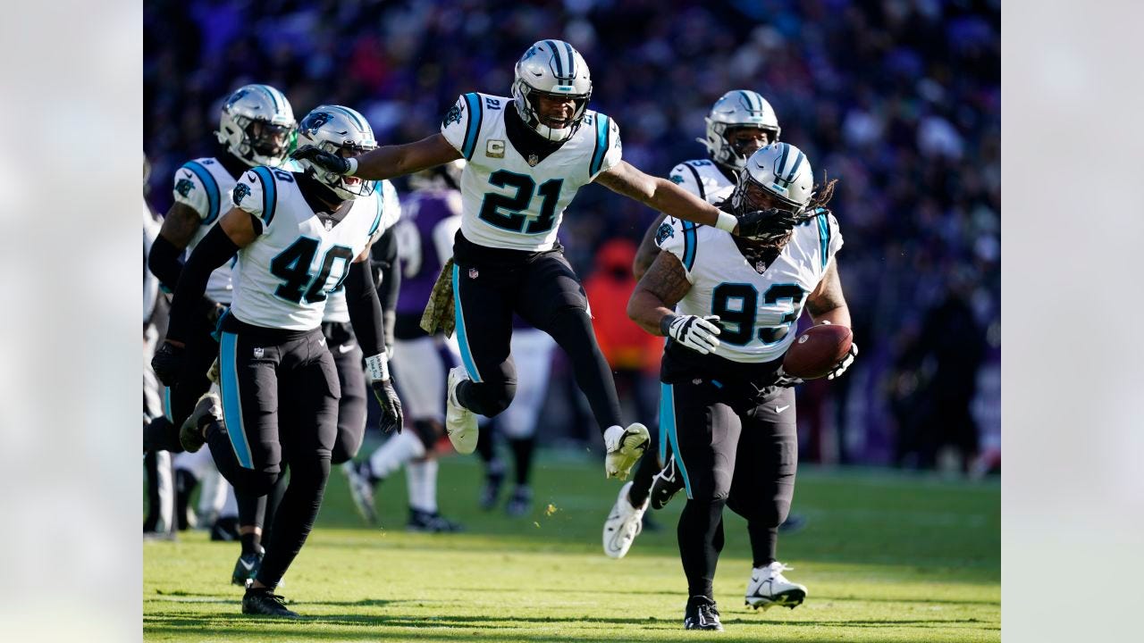 Carolina Panthers defensive tackle Bravvion Roy (93) and teammate safety Jeremy Chinn (21) celebrate an interception in the first half of an NFL football game against the Baltimore Ravens Sunday, Nov. 20, 2022, in Baltimore. (AP Photo/Patrick Semansky)