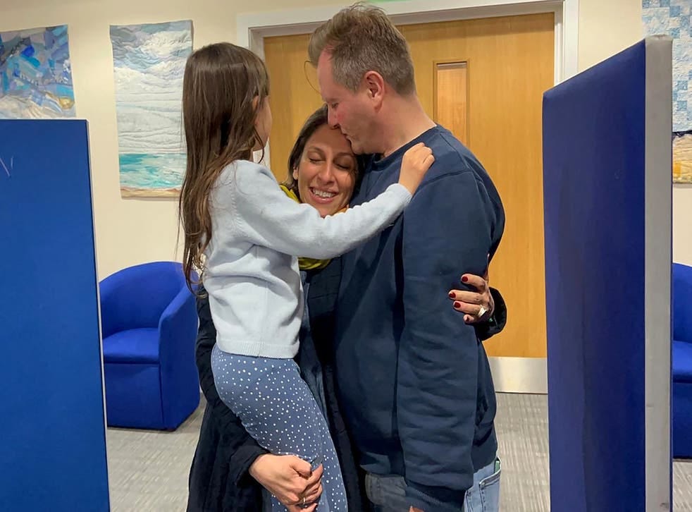 <p>A handout picture released by the Free Nazanin campaign group shows Nazanin Zaghari-Ratcliffe hugging her husband Richard Ratcliffe and their daughter Gabriella upon her arrival </p>