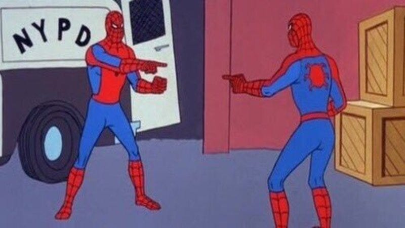 Image of two spidermans pointing at each other. 