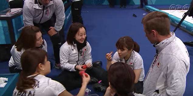 It involves food, so I feel OK using this shot of the curling team during "snack time"