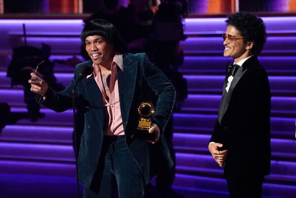 Anderson .Paak, left, and Bruno Mars of Silk Sonic, won song of the year and record of the year at the Grammy Awards on Sunday night in Las Vegas.