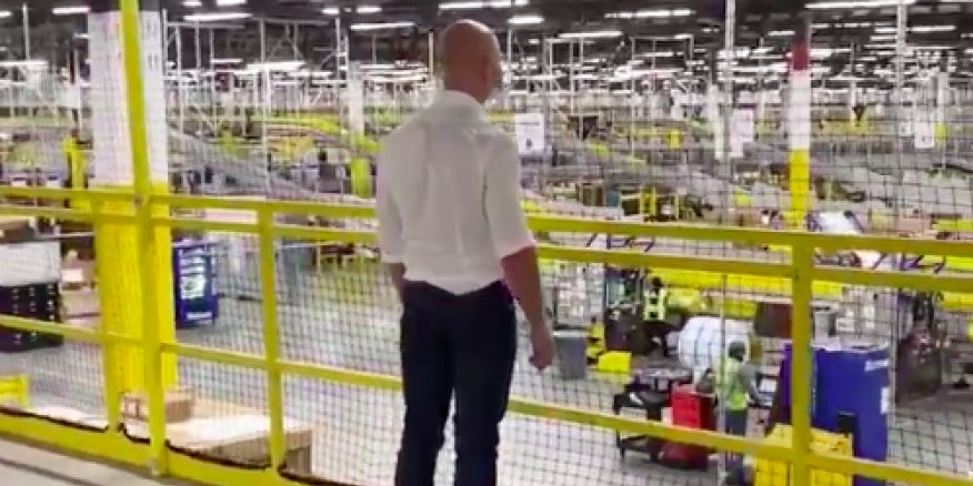 Amazon CEO Jeff Bezos looks on during a surprise to a Dallas warehouse in April 2020. Photo courtesy of Amazon