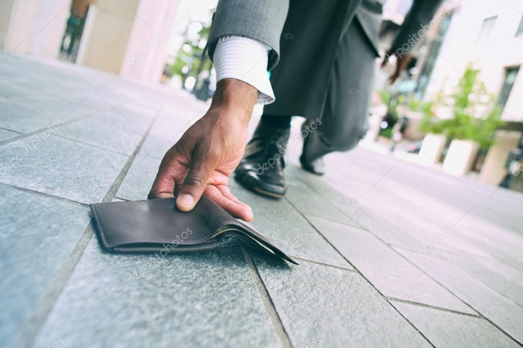 Wallet: Businessman Finds His Wallet On Sidewalk ⬇ Stock Photo, Image by ©  sjlocke #78629790