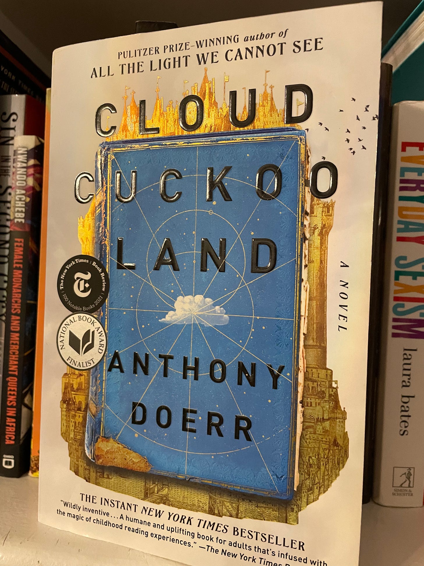 blue and gold book cover for cloud cuckoo land