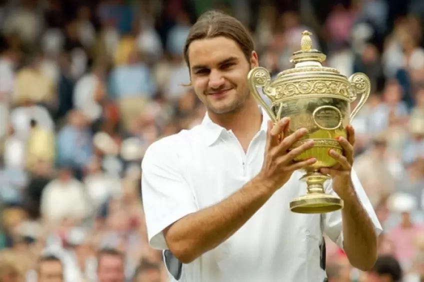Roger Federer with his 1st Wimbledon title in 2003.