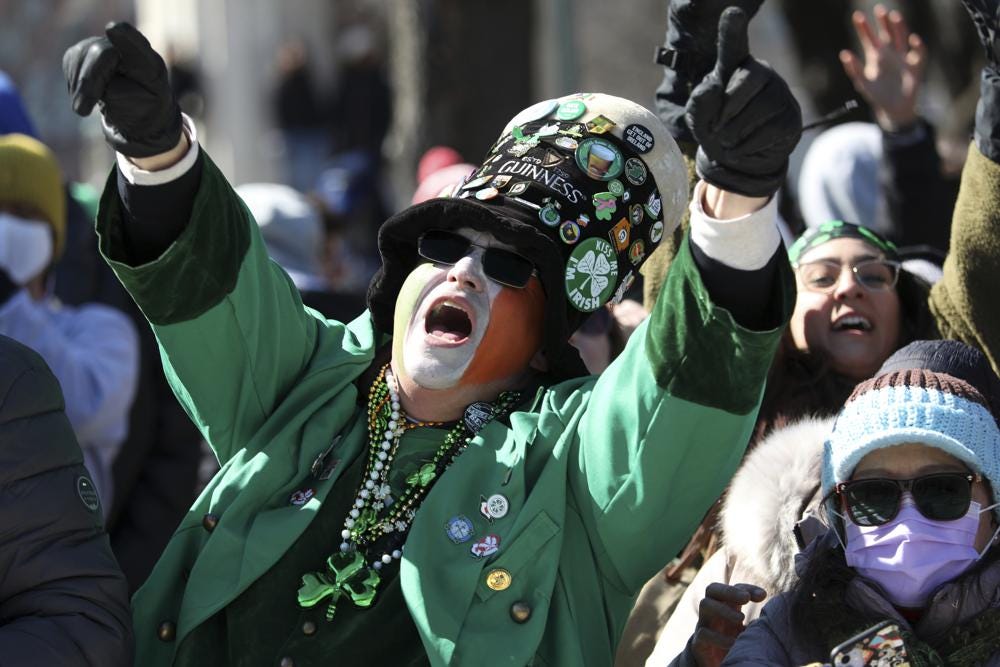 A parade goer yells during the St. Patrick's Day Parade along South Columbus Drive, Saturday, March 12, 2022, in Chicago. (John J. Kim/Chicago Tribune via AP)