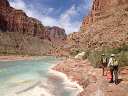 people walk along little colorado river