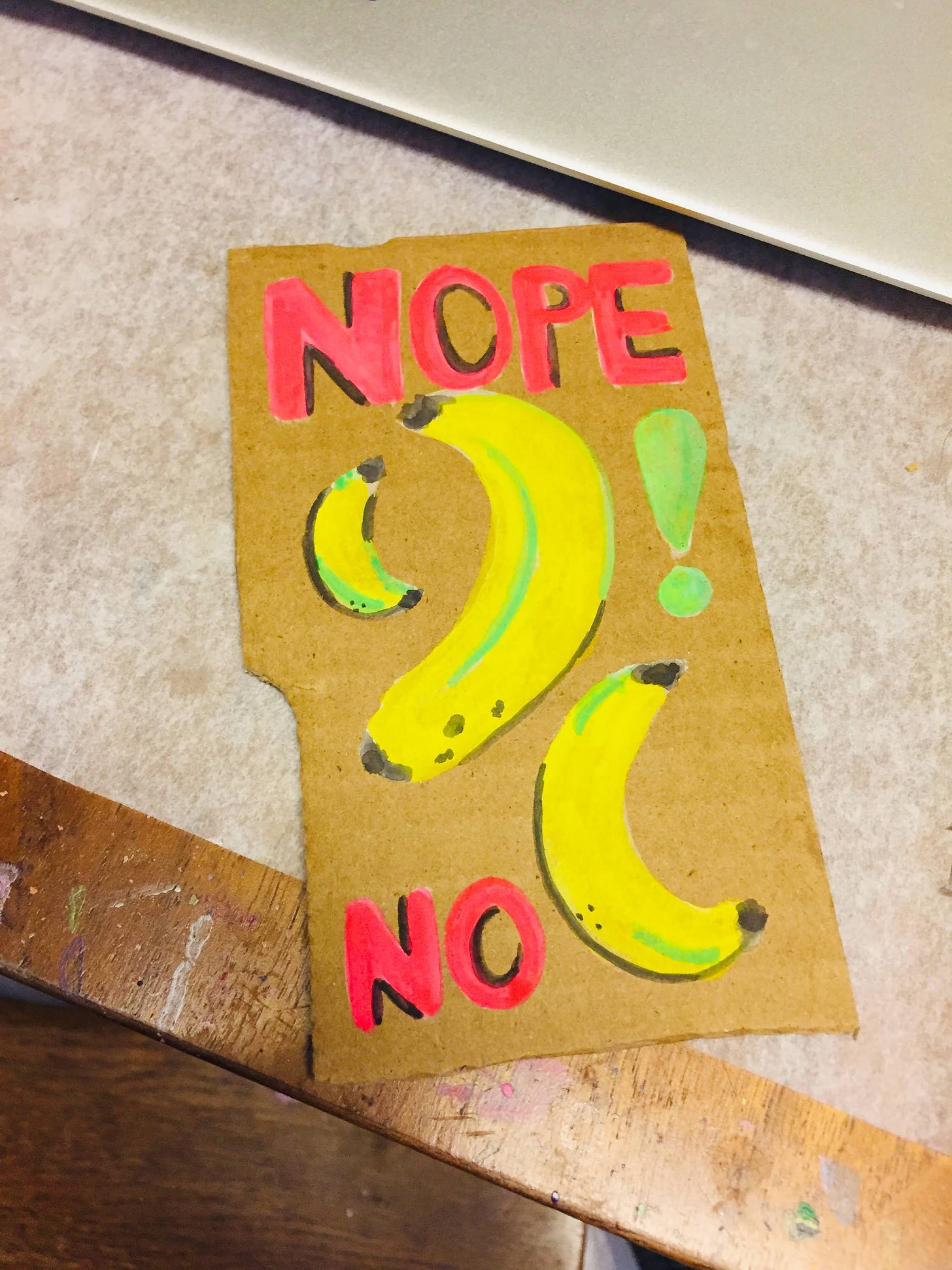 watercolor painting of three yellow bananas with a large Nope across the top and a large No on the bottom