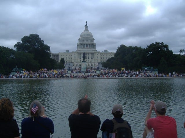 I was surprised how well you could hear the speakers way back here. No one could actually see the stage yet thousands congregated this far back because it was as close as they could get.