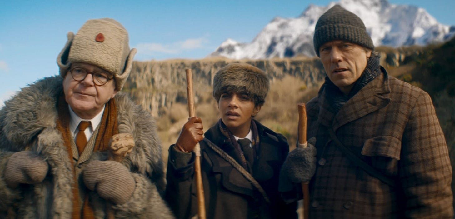 This image shows, from left to right, Professor Eustacius Jericho (played by Kevin McNally), Yasmin "Yaz" Khan (played by Mandip Gill), and Dan Lewis (played by John Bishop) as they consult a seer living in the mountains of 1904 Nepal who may know the date when the world will end. This image shows, from left to right, Professor Eustacius Jericho (played by Kevin McNally), Yasmin "Yaz" Khan (played by Mandip Gill), and Dan Lewis (played by John Bishop) as they consult a seer living in the mountains of 1904 Nepal who may know the date when the world will end.