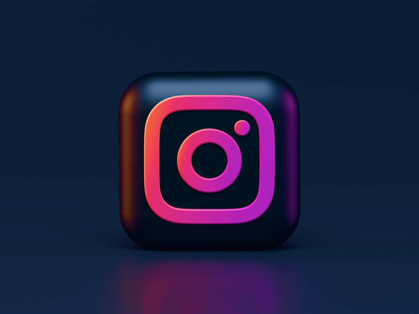 Illustration of Instagram's logo in black and pink. (Alexander Shatov / Unsplash)
