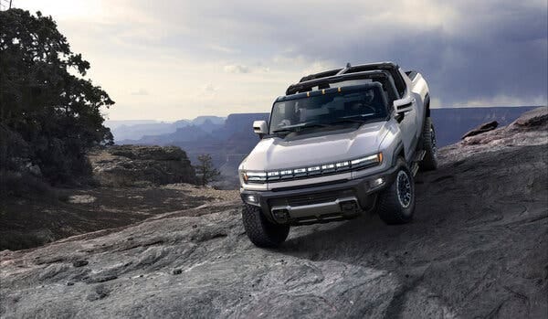 General Motors plans an electric Hummer pickup, with a high-end version due in showrooms this fall.