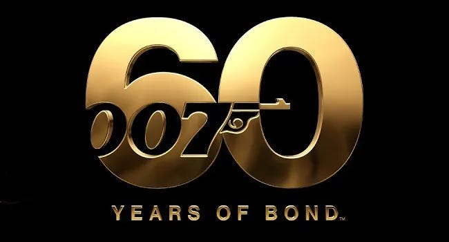 This image shows EON Productions' official "60 Years of James Bond" logo. The number "60" appears in large gold type against a black background, with the official 007 logo cut into these digits. The words "Years of Bond" appear underneath this image, completing the phrase "60 Years of Bond." This image shows EON Productions' official "60 Years of James Bond" logo. The number "60" appears in large gold type against a black background, with the official 007 logo cut into these digits. The words "Years of Bond" appear underneath this image, completing the phrase "60 Years of Bond."