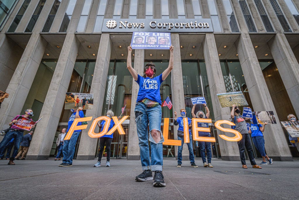 Protesters gather in front of Fox Headquarters in Manhattan in September to protest the network's promotion of climate misinformation. (Erik McGregor / Getty Images)