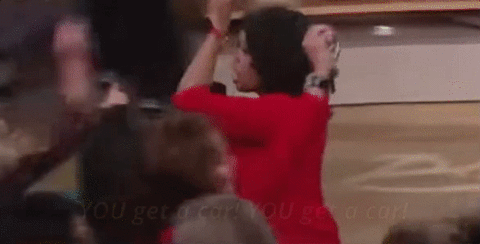 GIF of Oprah Winfrey pointing to the show audience, subtitled ‘You get a car! You get a car!