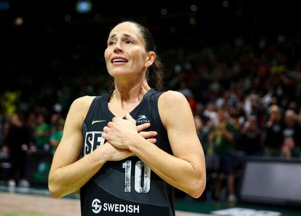 Seattle Storm guard Sue Bird is retiring from the W.N.B.A. after 21 years. She became emotional as her home crowd cheered for her after the Storm lost to the Aces on Tuesday.