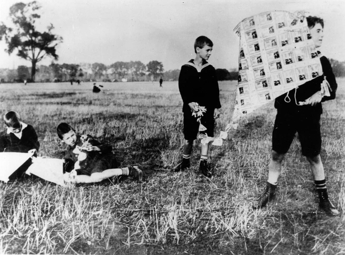 Boys fly a kite made of banknotes. 1922.