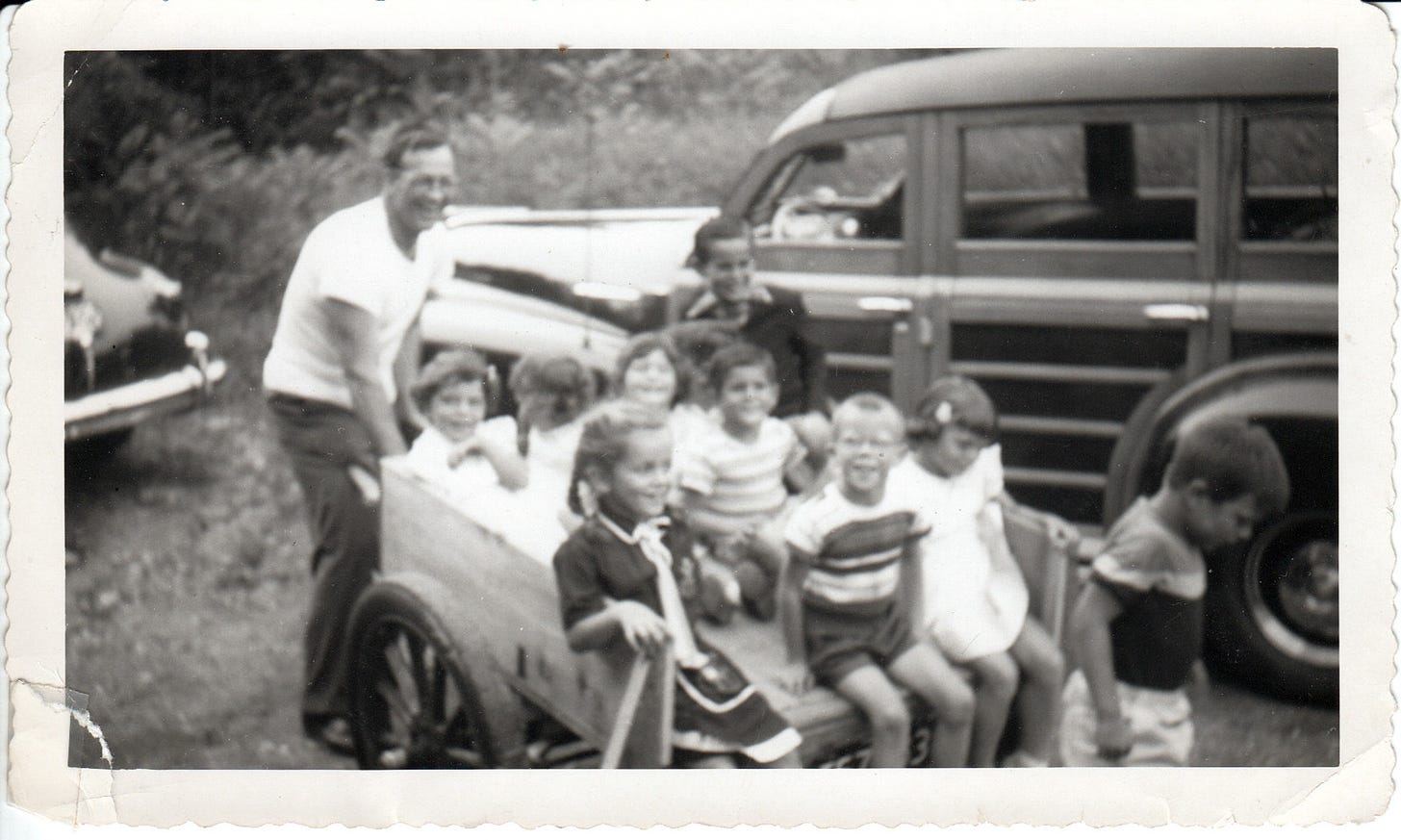 Cathy Daly, Jack Daly, John Dempsey, Peter Mann, Steven Dempsey, Tom Dempsey, Wendy Mann  in Parker Ward's Trailer in front of 1946 Pontiac Station Wagon.