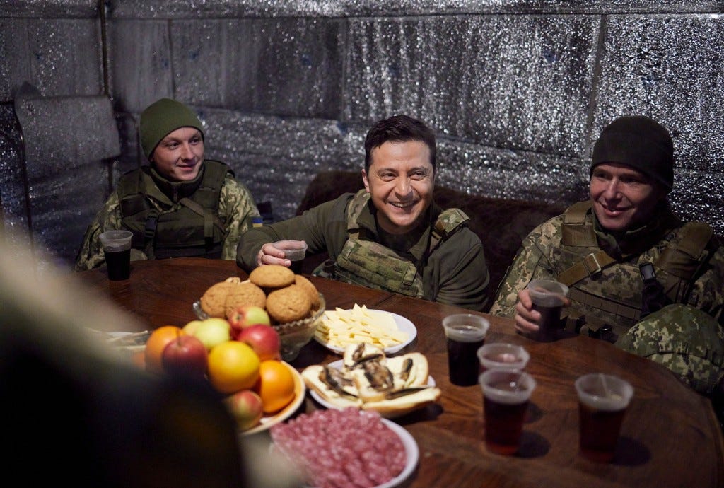 Volodymyr Zelensky enjoying a drink with Ukrainian soldiers.