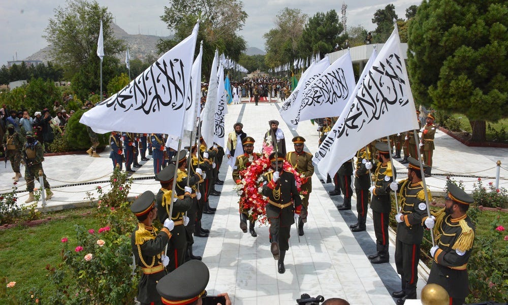 A group of people marching with flags

Description automatically generated with low confidence