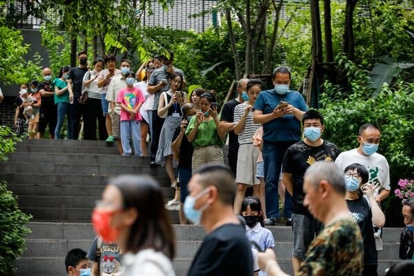 A line to be tested for the coronavirus in Chongqing, China, last week.