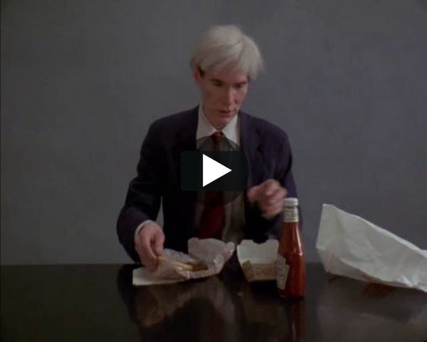 Warhol eating a Hamburger