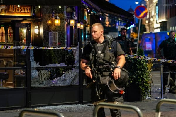 Police officers at the site of a mass shooting early Saturday in downtown Oslo.