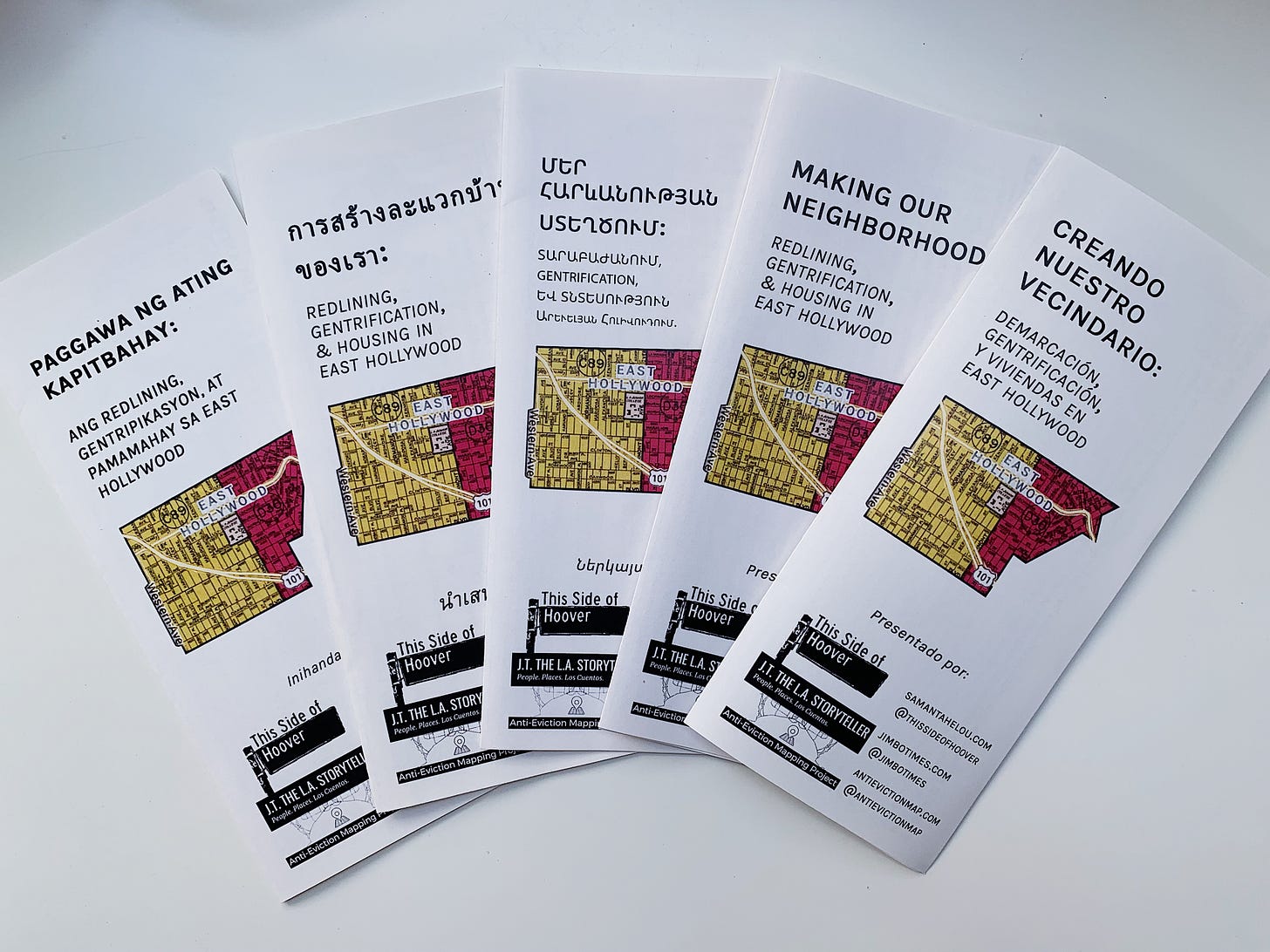 Photo of five informational pamphlets in Tagolog, Thai, Armenian, English, and Spanish. They say “Making Our Neighborhood: Redlining, Gentrification, and Housing in East Hollywood.” Below that is an image of a redlined map of East Hollywood. 