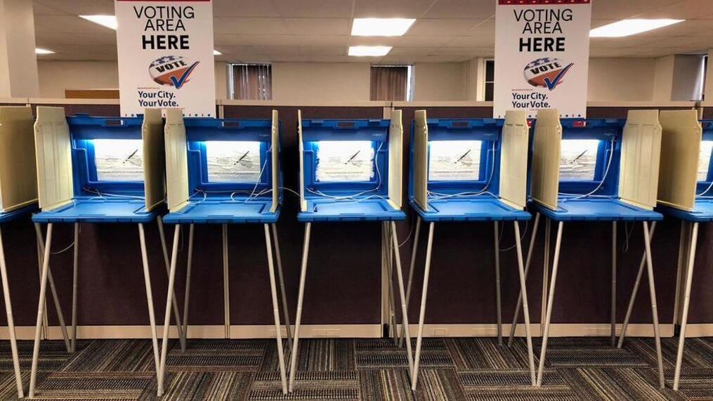 Voting booths stand ready in downtown Minneapolis on Thursday, Sept. 20, 2018, for Friday's opening of early voting in Minnesota. Minnesota and South Dakota are tied for the earliest start in the country for early voting in the 2018 midterm elections. (AP Photo/Steve Karnowski)<p>{/p}