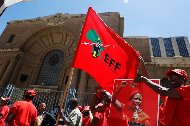 EFF supporters sing outside the Johannesburg high court during the party's legal battle with AfriForum over the 'kill the boer' song. Photo Thulani Mbele