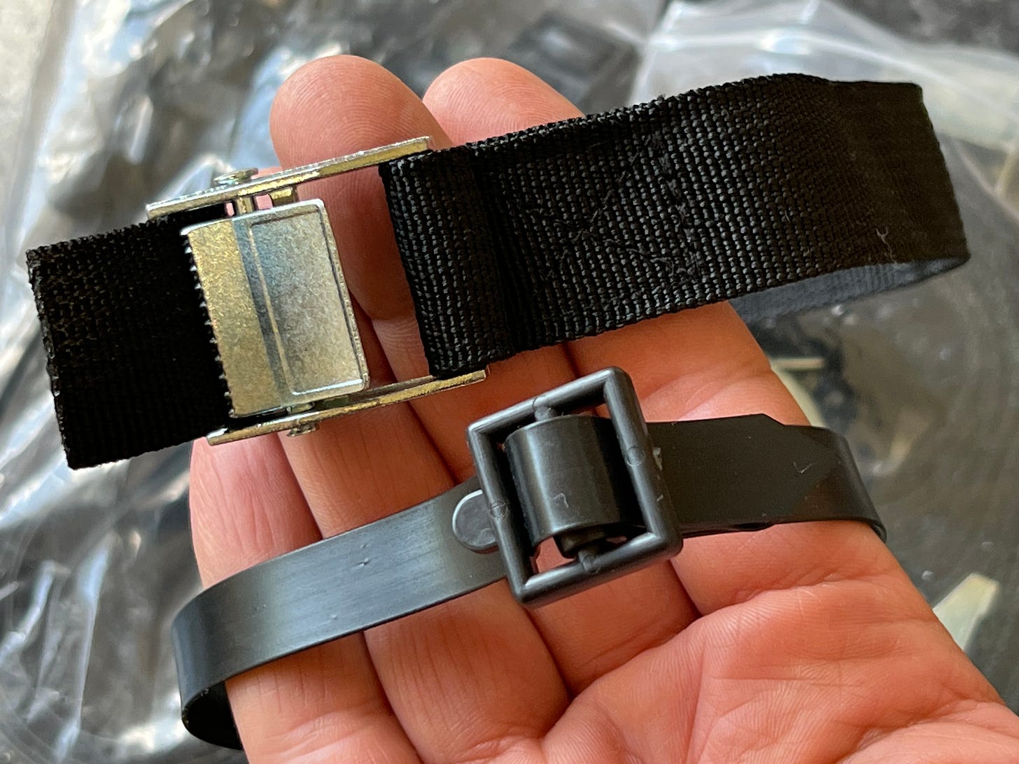two types of straps are shown in a hand