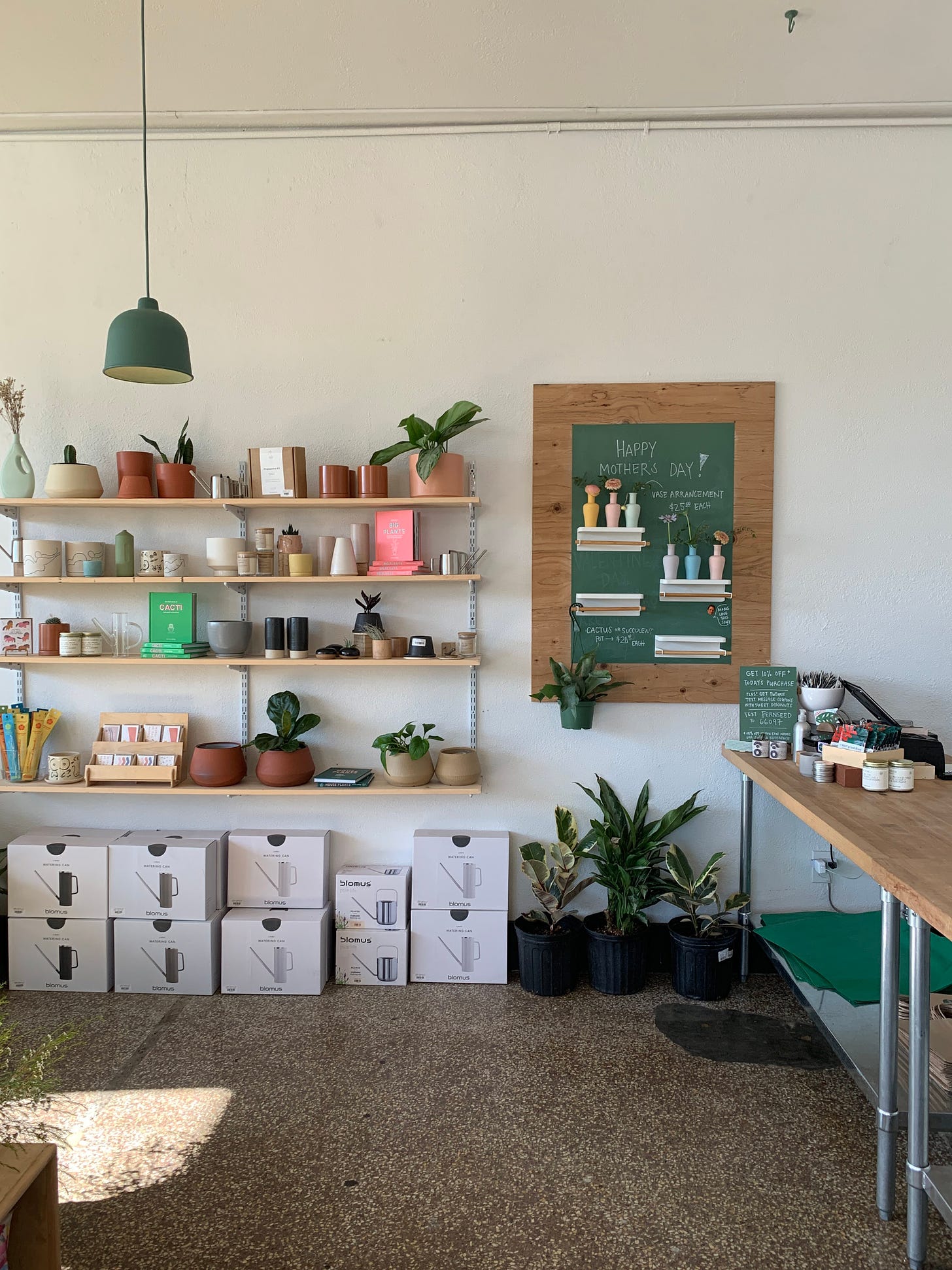 retail shop with shelves on large white wall