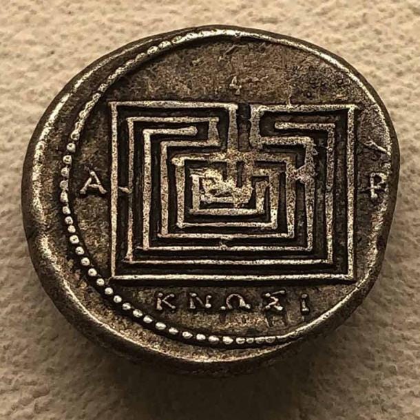 Silver coin minted in Knossos, Crete, around 300 to 270 BC, with labyrinthine imagery inspired by mythological tales of the multicursal labyrinth created to contain the deadly Minotaur. (Hispalois / CC BY-SA 4.0)