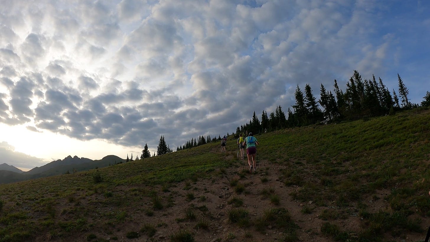 puffy clouds at the summit