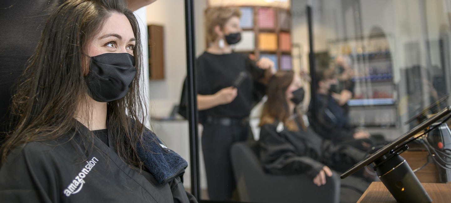 Woman having hair styled at Amazon Salon