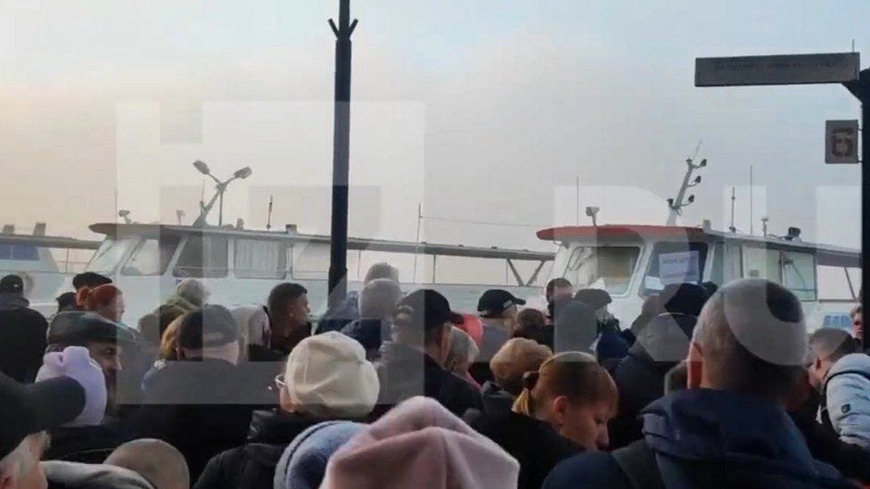 Russia's Izvestia website showed footage of people gathering to cross the Dnieper river
