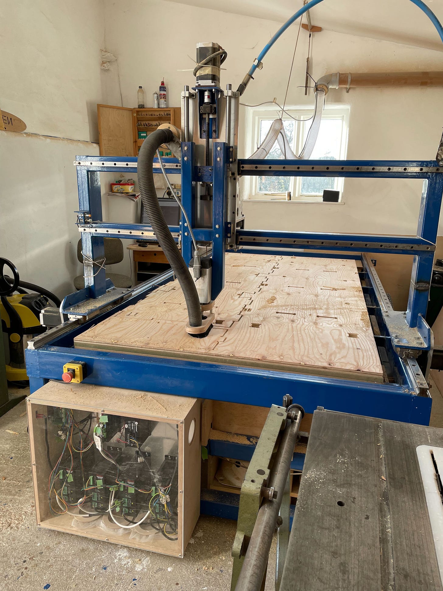 Image of a handmade CNC machine inside a small workshop