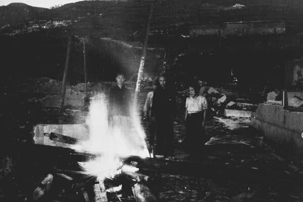 A family cremating its dead in Nagasaki in September 1945.