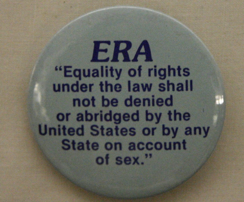 a plate with the equal rights amendment written on it