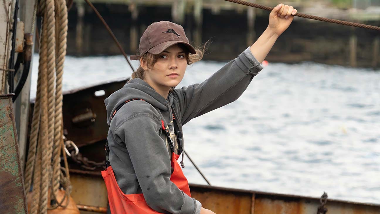 photo of a young woman on a fishing trawler