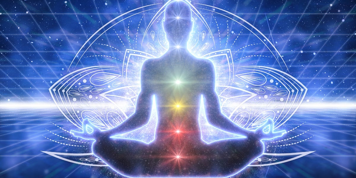 The image shows a silhouette figure in sitting meditation pose. Bright sparkles are there in the background. Certain points in a vertical straight line from head to stomach is shown through flowers. The image is part of the article titled “How do I know if my Kundalini got activated?” authored by Anish Prasad and published at https://rationalastro.org