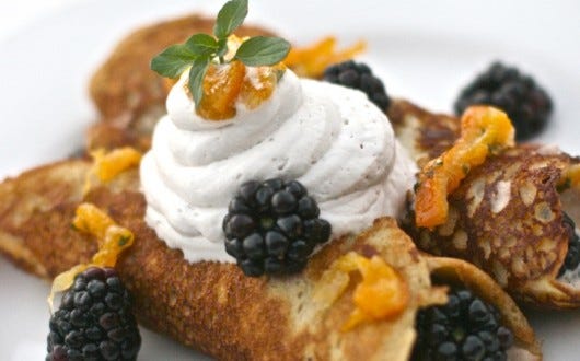 Plantain crepes topped with yogurt and berries