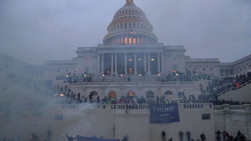 US Capitol in smoke during the insurrection on Jan 6, 2021.