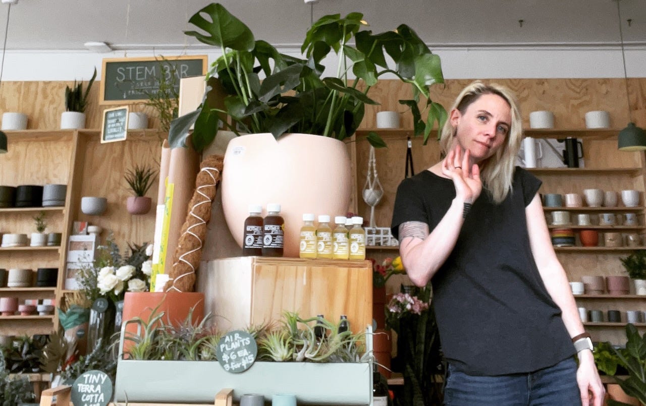 woman posing inside a plant shop